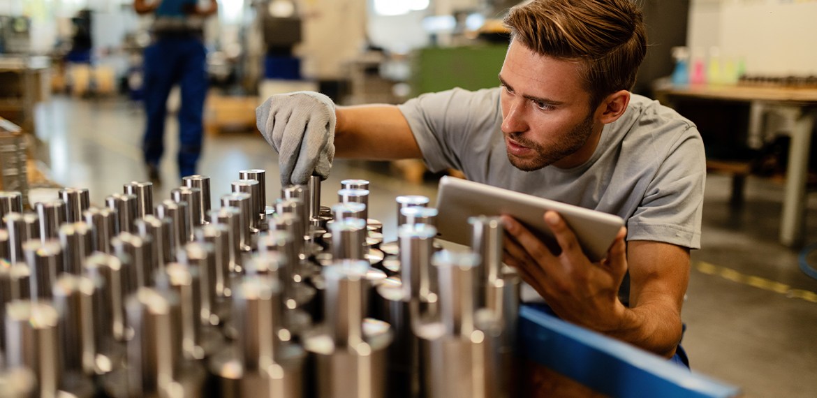 Factory worker checking inventory