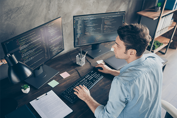 Man coding at work