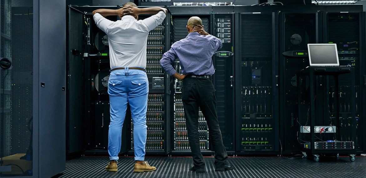 Stressed men looking at servers