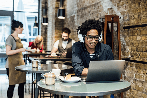 Person working on a computer in a cafe