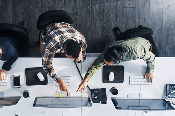 People looking at a computer