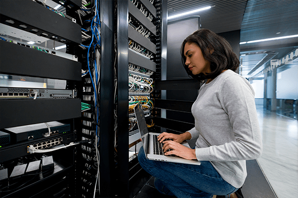 Woman working in server room