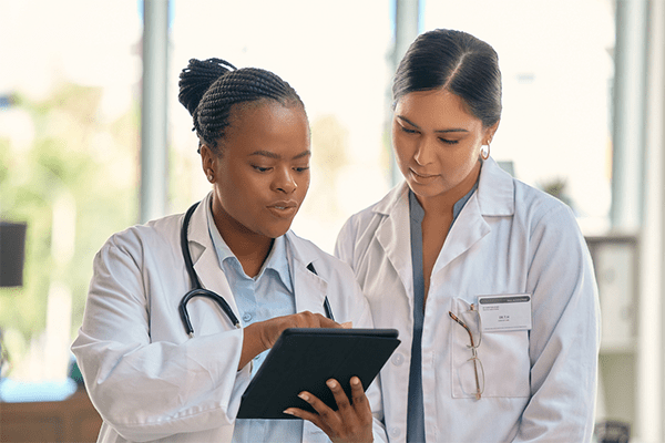 Doctors looking at patient records