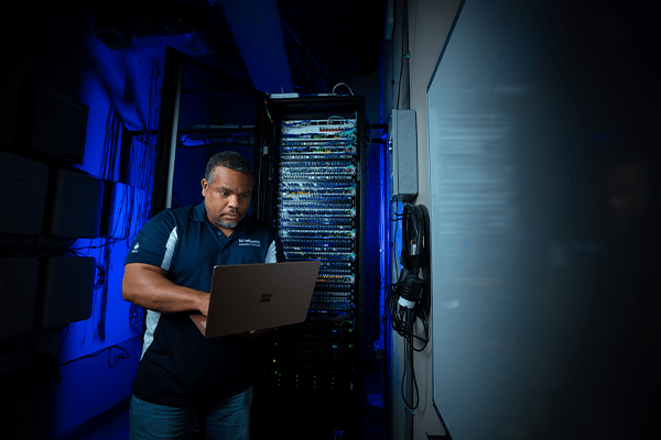 MITS team member working in a server room