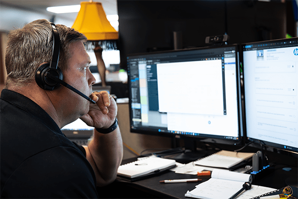 MITS team member researching on computer