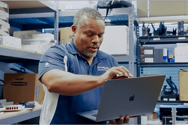 MITS team member working on new computer