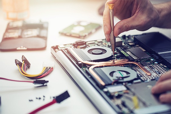 Person fixing a computer
